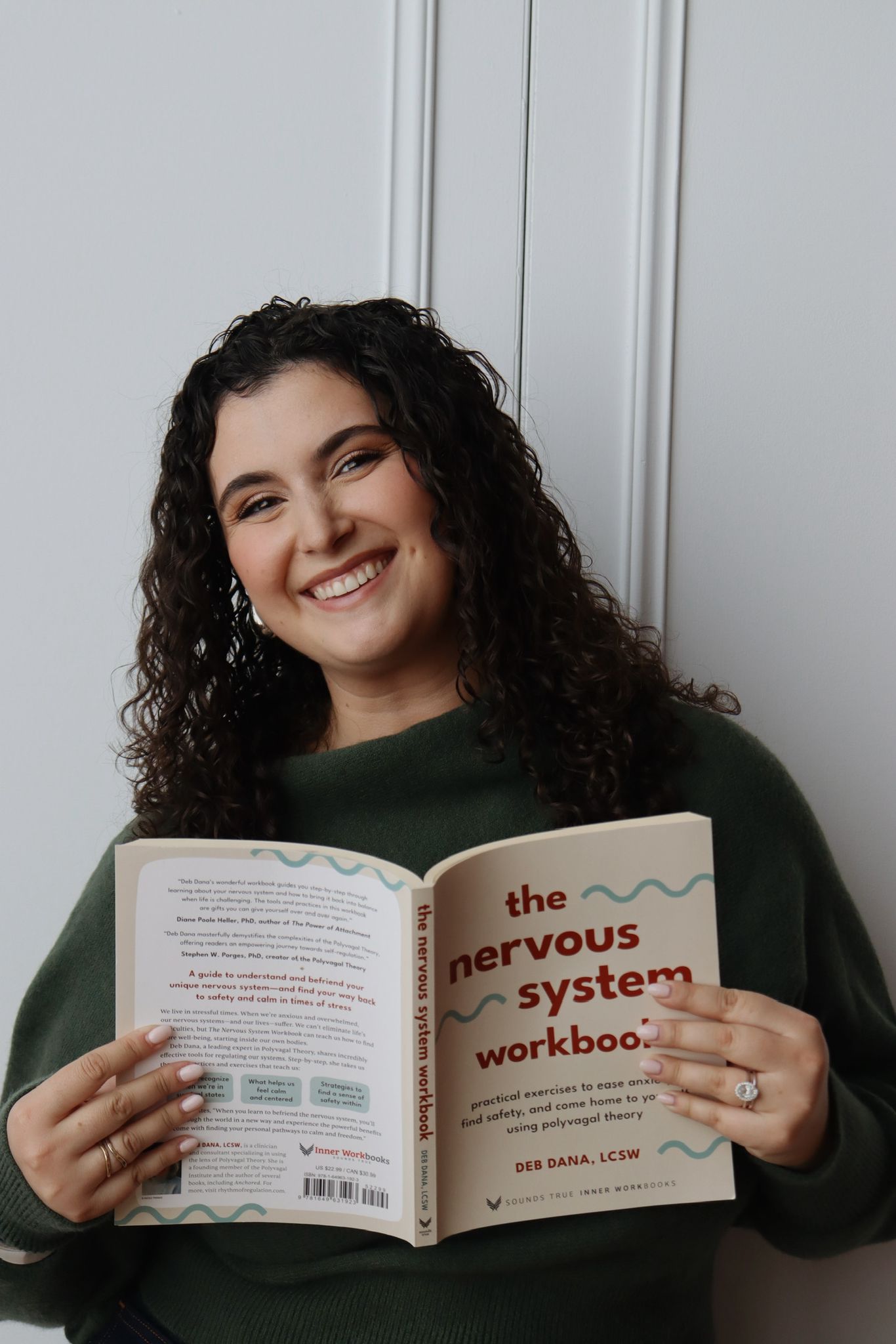 Holding open nervous system workbook wide